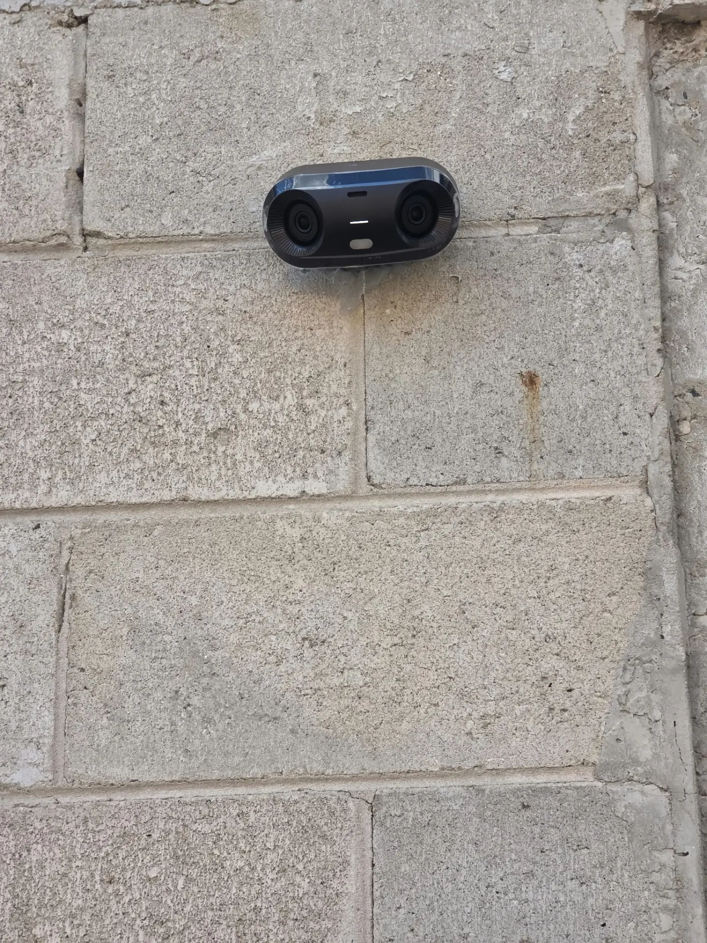 Dual-lens camera installed on an exterior wall